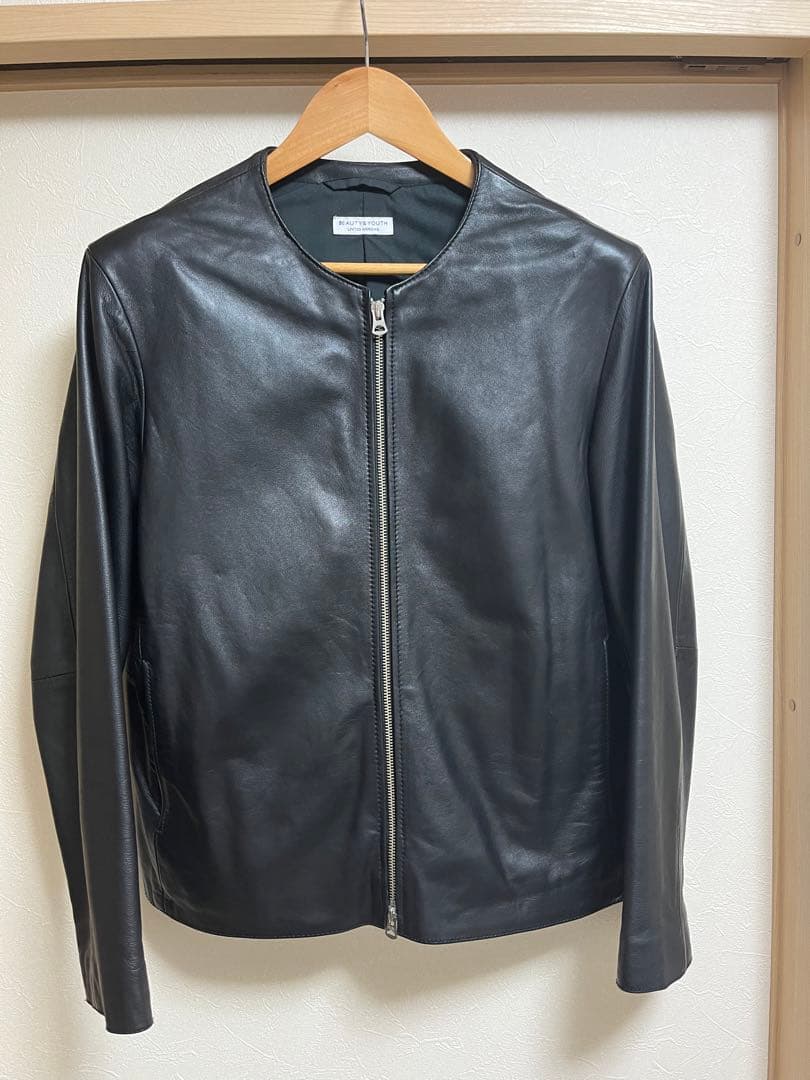 黒ノーカラーレザーシングルライダースジャケット