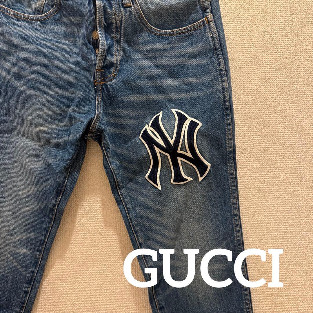 GUCCI NYロゴ刺繍デニムパンツ