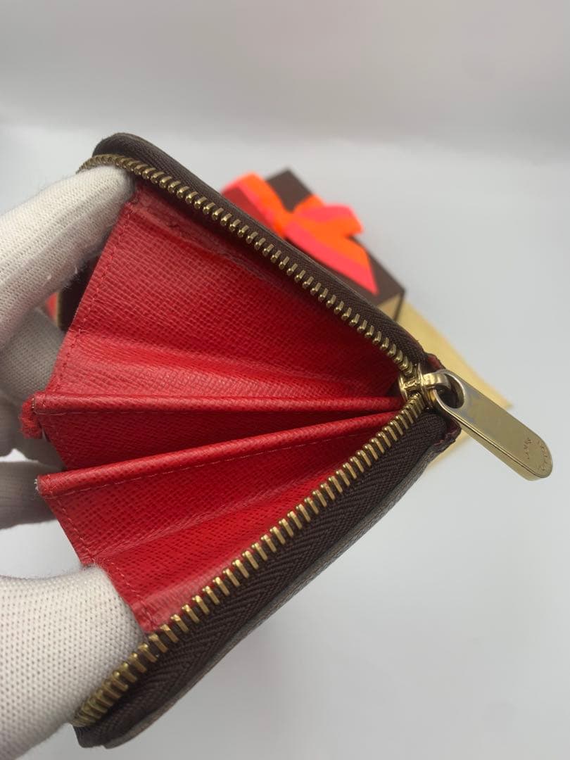 ルイヴィトン モノグラム ステッカー ジッピーウォレットコクリコ 長財布 P55